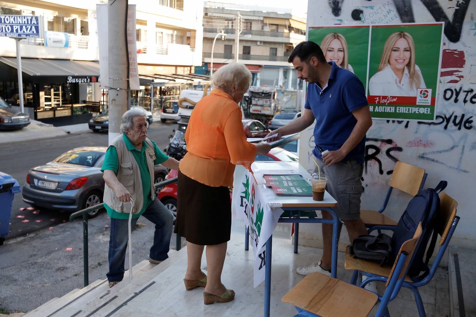 People are seen at a polling station during the general election in Athens