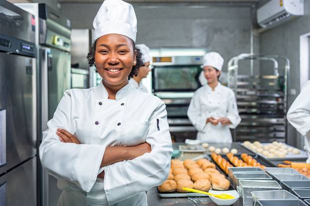 Smiling,African,Female,Bakers,Looking,At,Camera..chefs,Baker,In,A