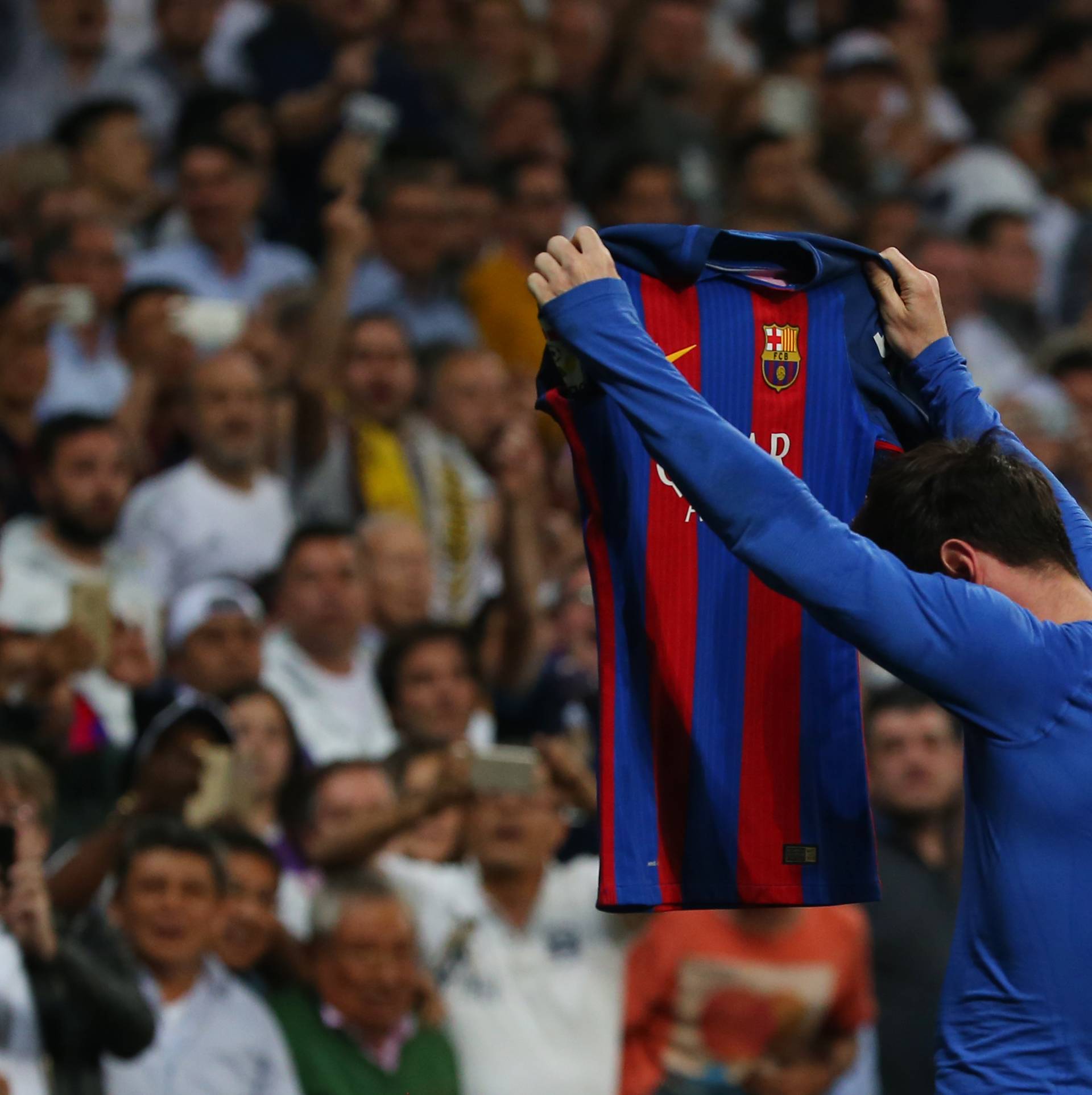 Barcelona's Lionel Messi celebrates scoring their third goal