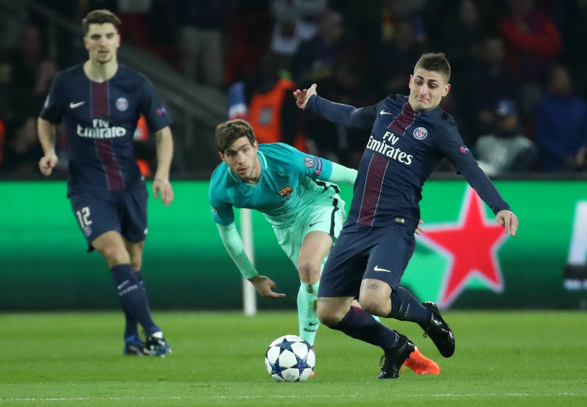 Barcelona's Sergi Roberto in action with Paris Saint-Germain's Marco Verratti