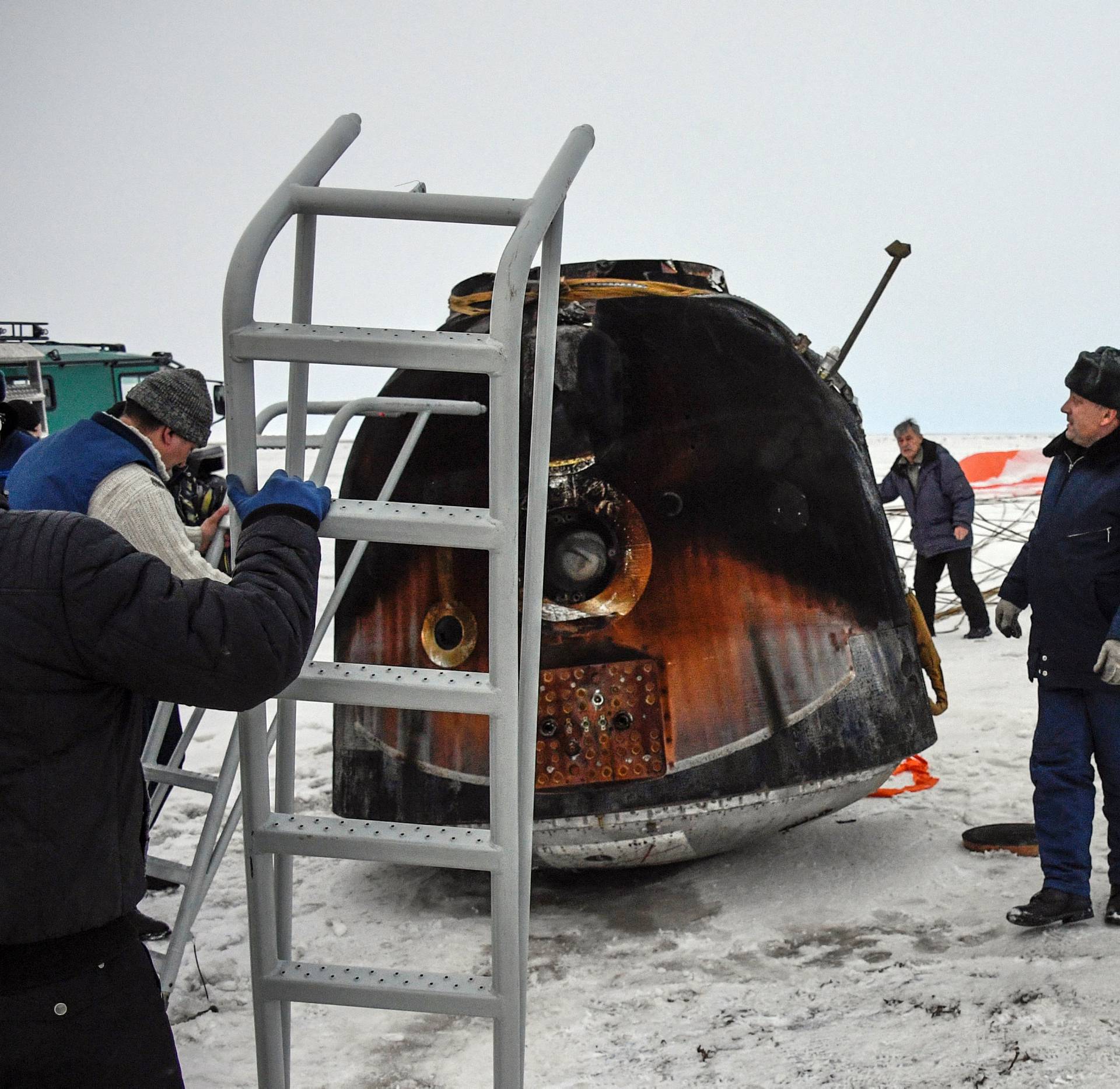 A Search and rescue team works at the landing site of the Soyuz MS-06 space capsule with International Space Station crew members, in a remote area outside the town of Dzhezkazgan