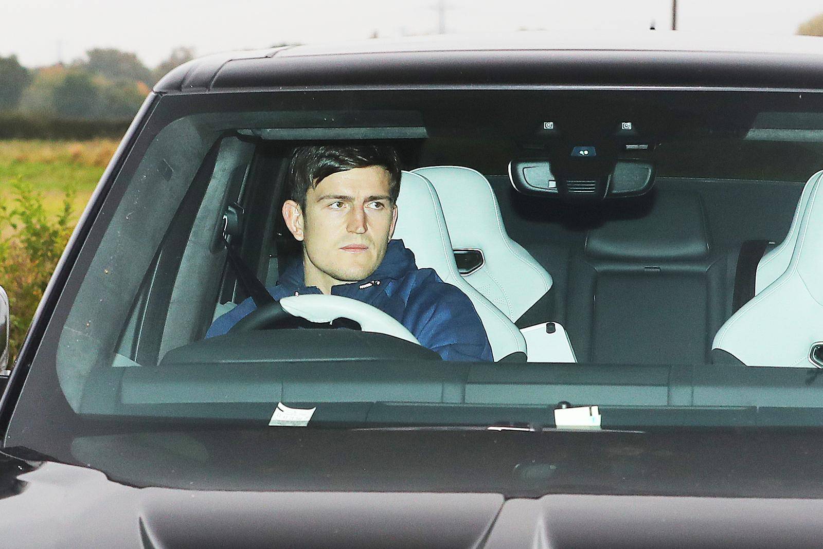 Manchester United players arrive for a training session - AON Carrington Training Complex