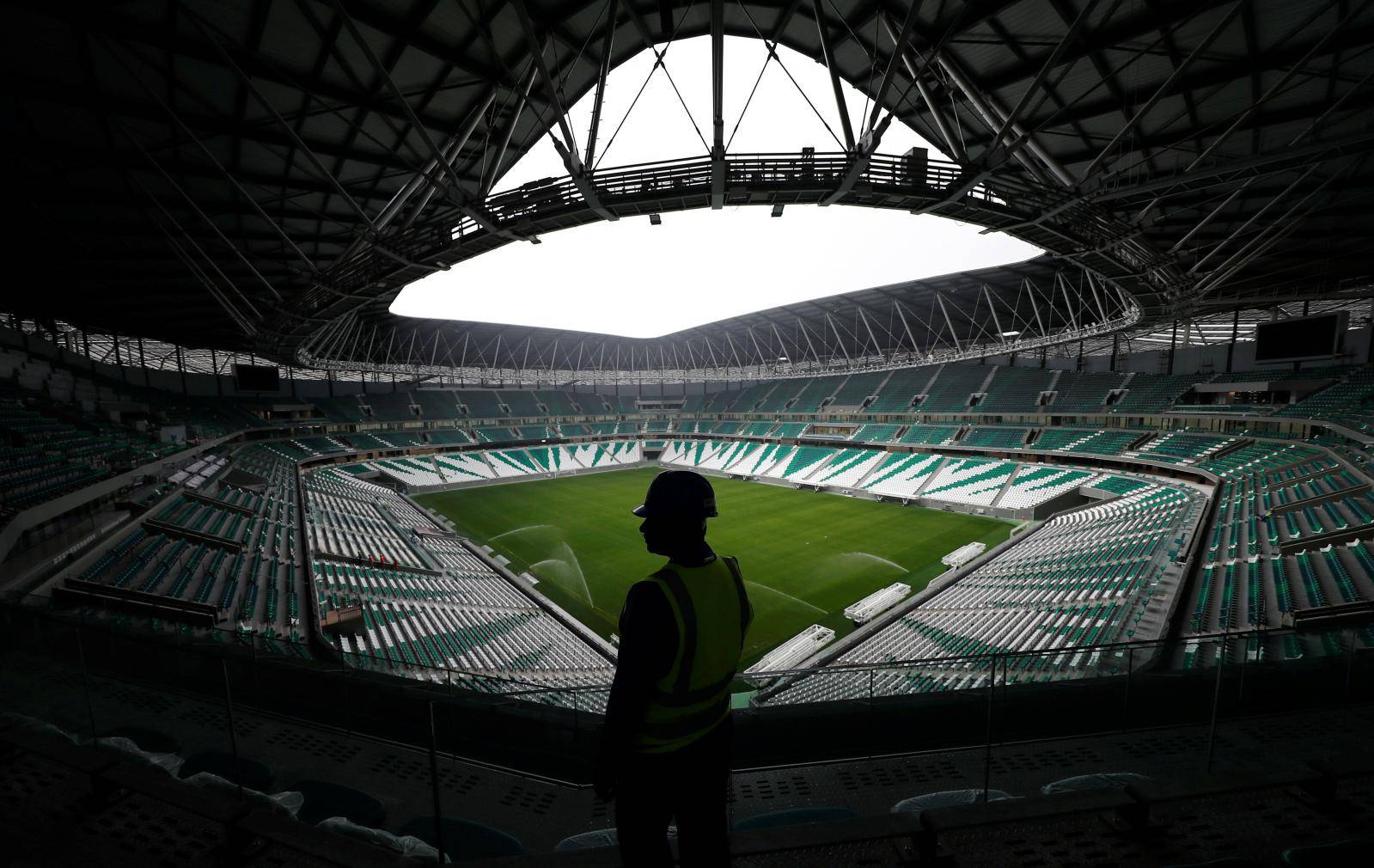 A worker is seen inside the Education City Stadium built for the upcoming 2022 FIFA World Cup soccer championship during a stadium tour in Doha