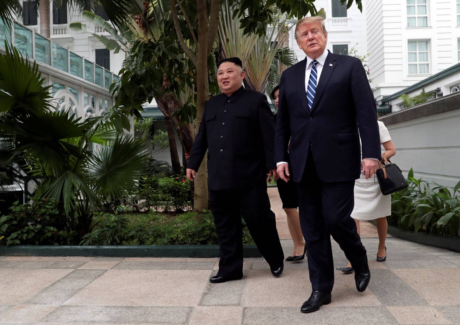 North Korean leader Kim Jong Un and U.S. President Donald Trump walk in the garden of the Metropole hotel during the second North Korea-U.S. summit in Hanoi, Vietnam