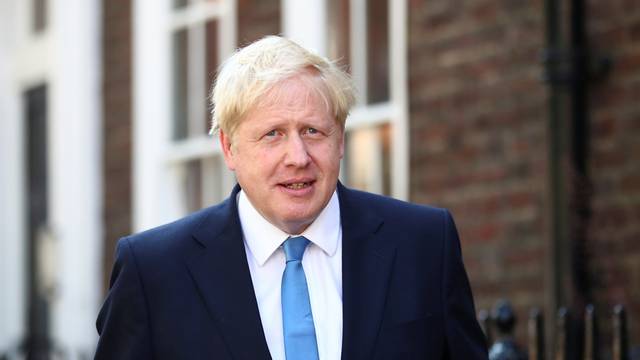 Boris Johnson is seen outside his office in London