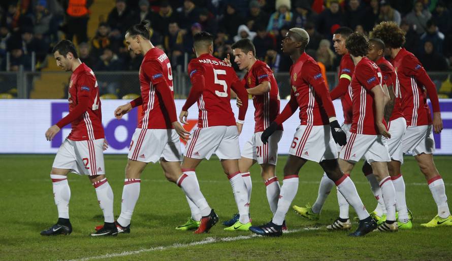 Manchester United's Henrikh Mkhitaryan celebrates scoring their first goal with team mates