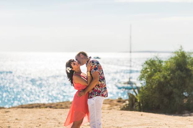 Romantic couple kissing on the beach