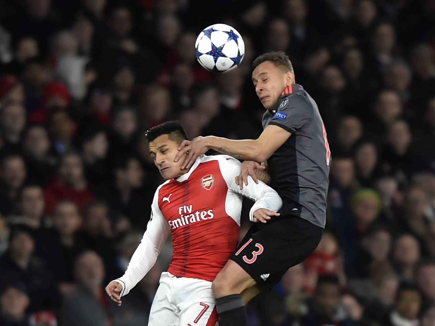 Arsenal's Alexis Sanchez in action with Bayern Munich's Rafinha