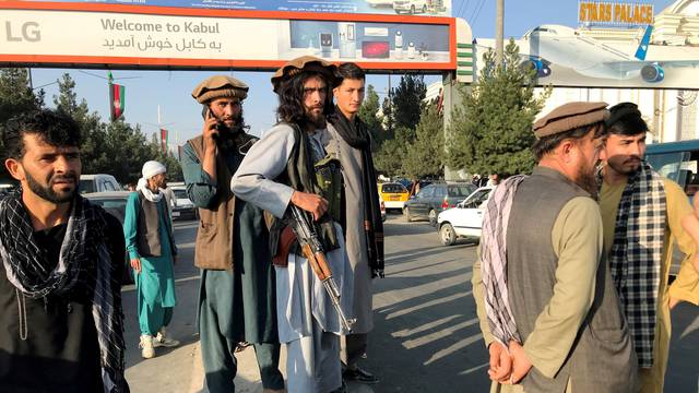 A member of Taliban stands outside Hamid Karzai International Airport in Kabul