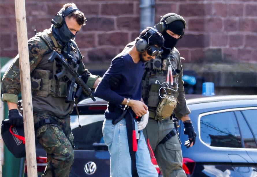 Police escort the suspect for Solingen's stabbing rampage, in Karlsruhe
