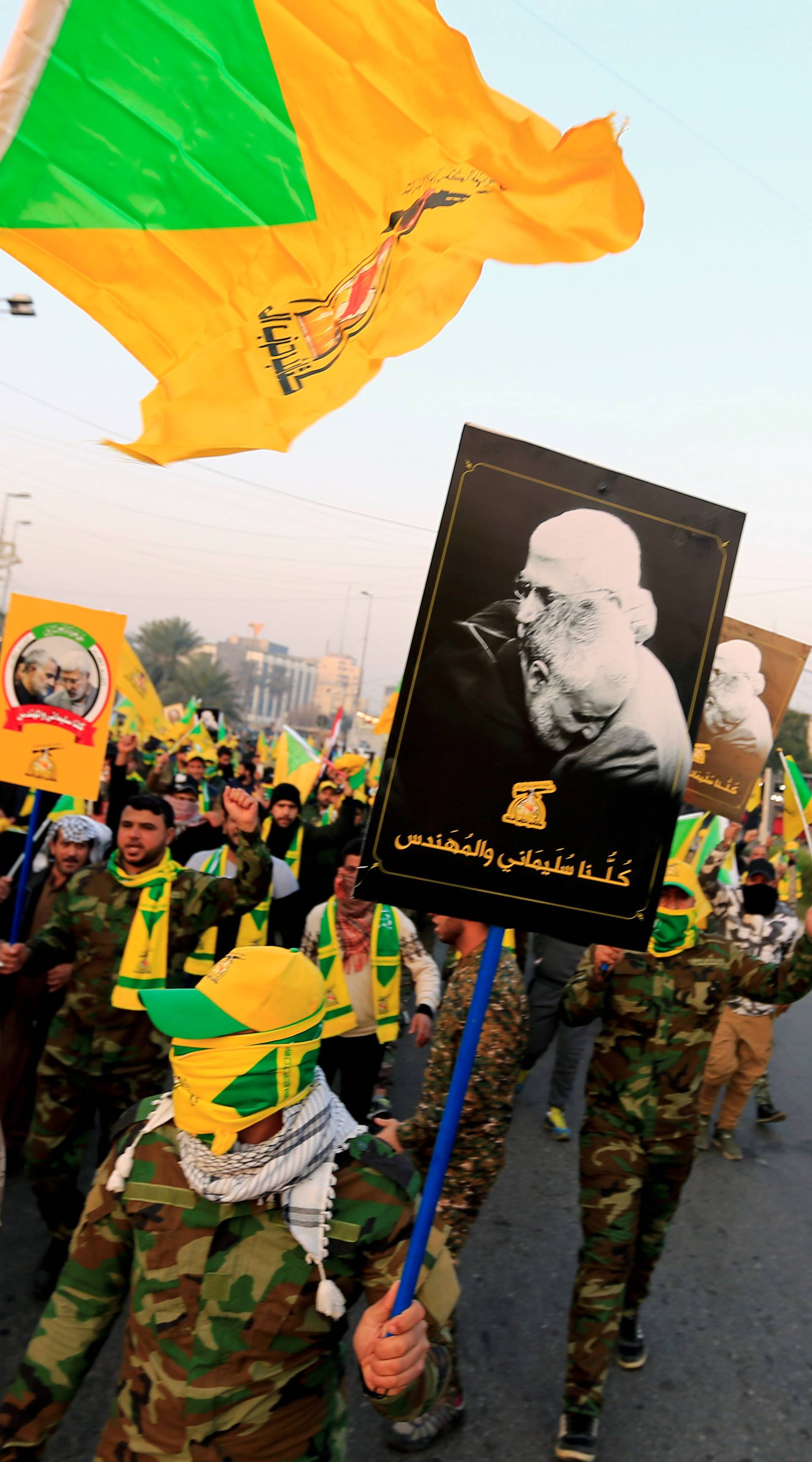 Kataib Hezbollah Iraqi militia gather ahead of the funeral of the Iraqi militia commander Abu Mahdi al-Muhandis, who was killed in an air strike at Baghdad airport, in Baghdad