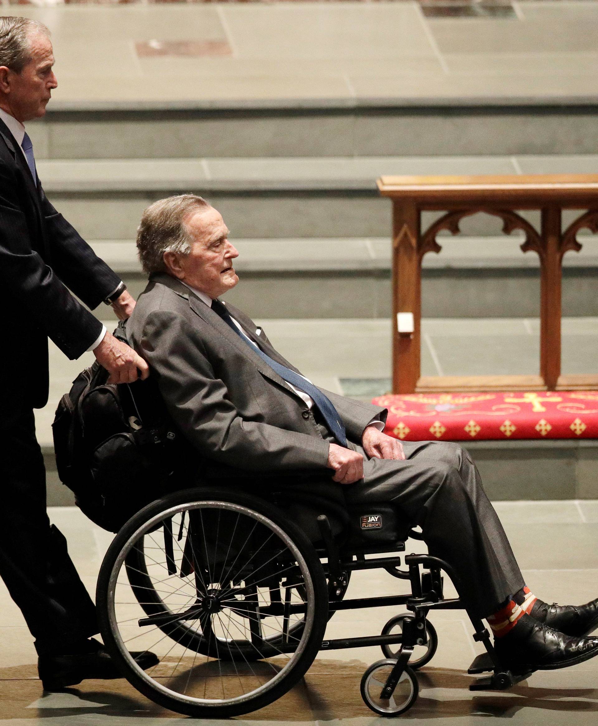 Former Presidents George W. Bush, and George H.W. Bush arrive at St. Martin's Episcopal Church for funeral services for former first lady Barbara Bush in Houston