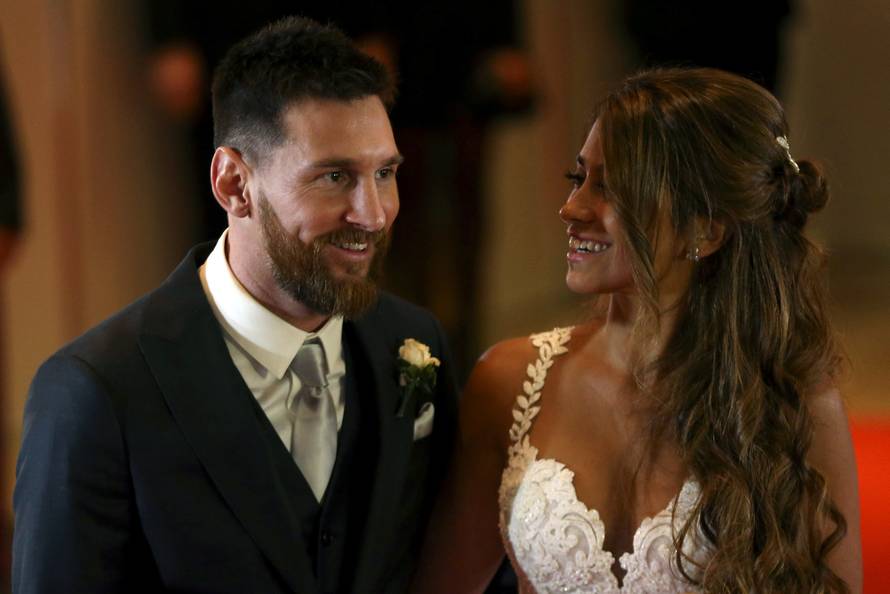 Argentine soccer player Lionel Messi and his wife Antonela Roccuzzo pose at their wedding in Rosario, Argentina