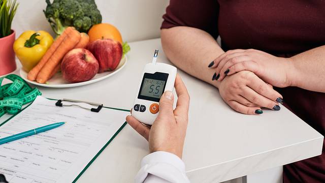 Measuring Blood Sugar. Nutritionist Using Glucometer Tests Overw