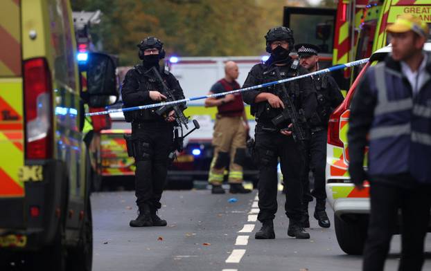 Emergency personnel work at the scene following an incident outside a synagogue, in Manchester