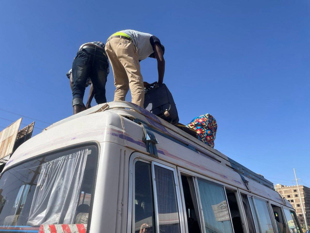 People gather at the station to flee from Khartoum