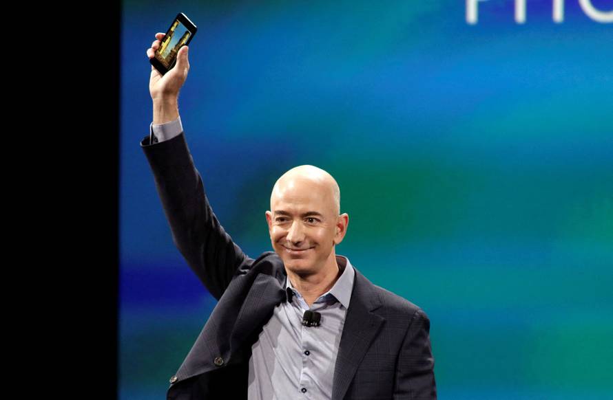 FILE PHOTO: Amazon CEO Jeff Bezos shows off his company's new smartphone, the Fire Phone, in Seattle, Washington