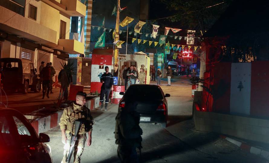 Lebanese army soldiers stand guard at the entrance of the Palestinian camp where an explosion took place in Tyre