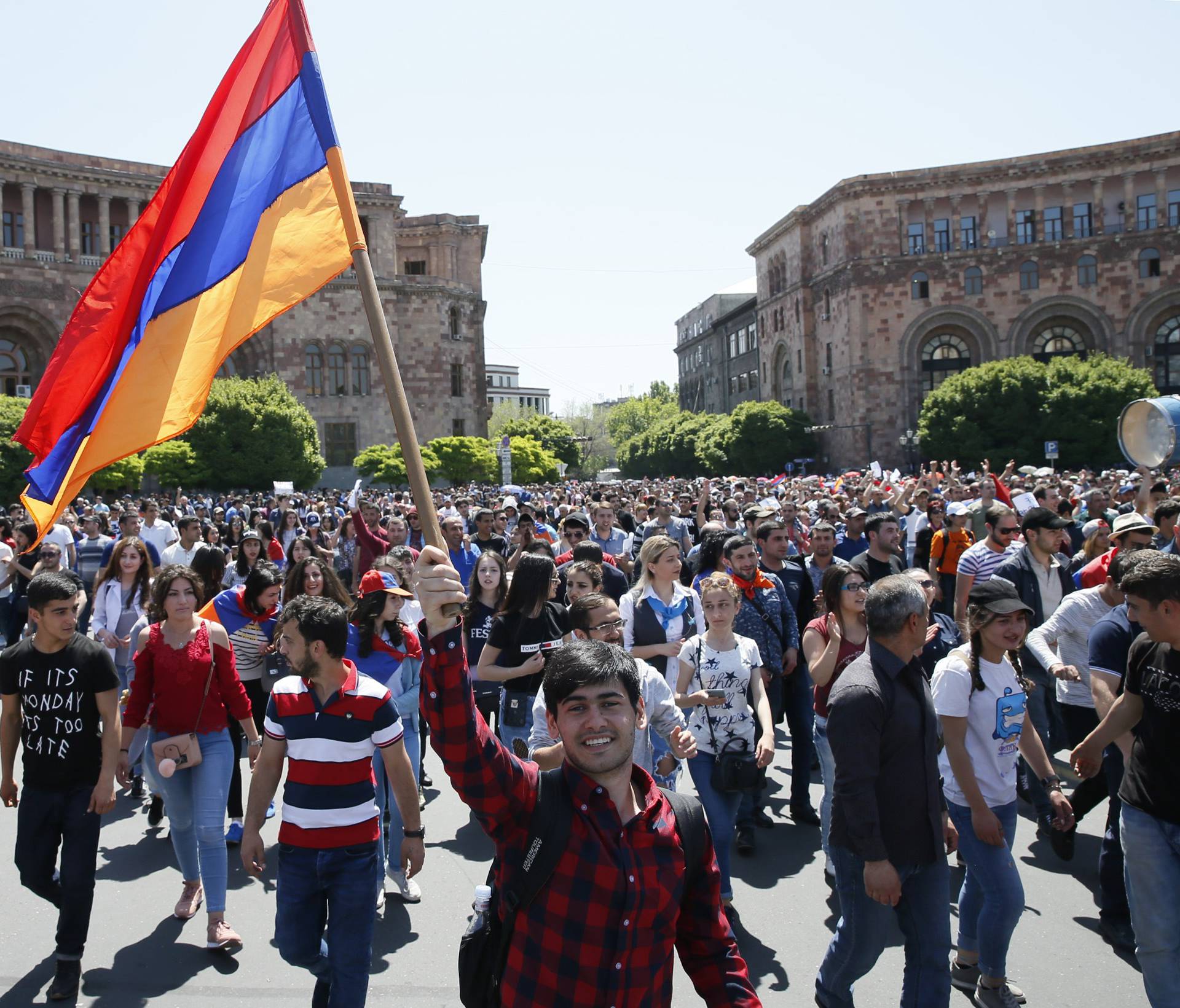 Armenian opposition supporters walk on the street after protest movement leader Nikol Pashinyan announced a nationwide campaign of civil disobedience in Yerevan