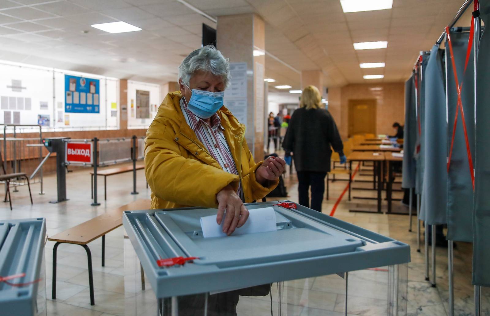 Woman casts a ballot during municipal elections in Tomsk