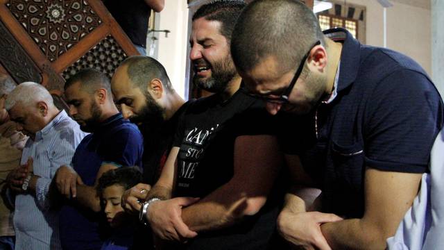 Relatives of the victims of the missing EgyptAir flight MS804 hold an absentee funeral prayer in a mosque nearby Cairo airport, in Cairo 