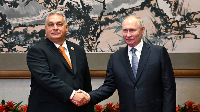 FILE PHOTO: Russian President Putin and Hungarian Prime Minister Orban meet in Beijing