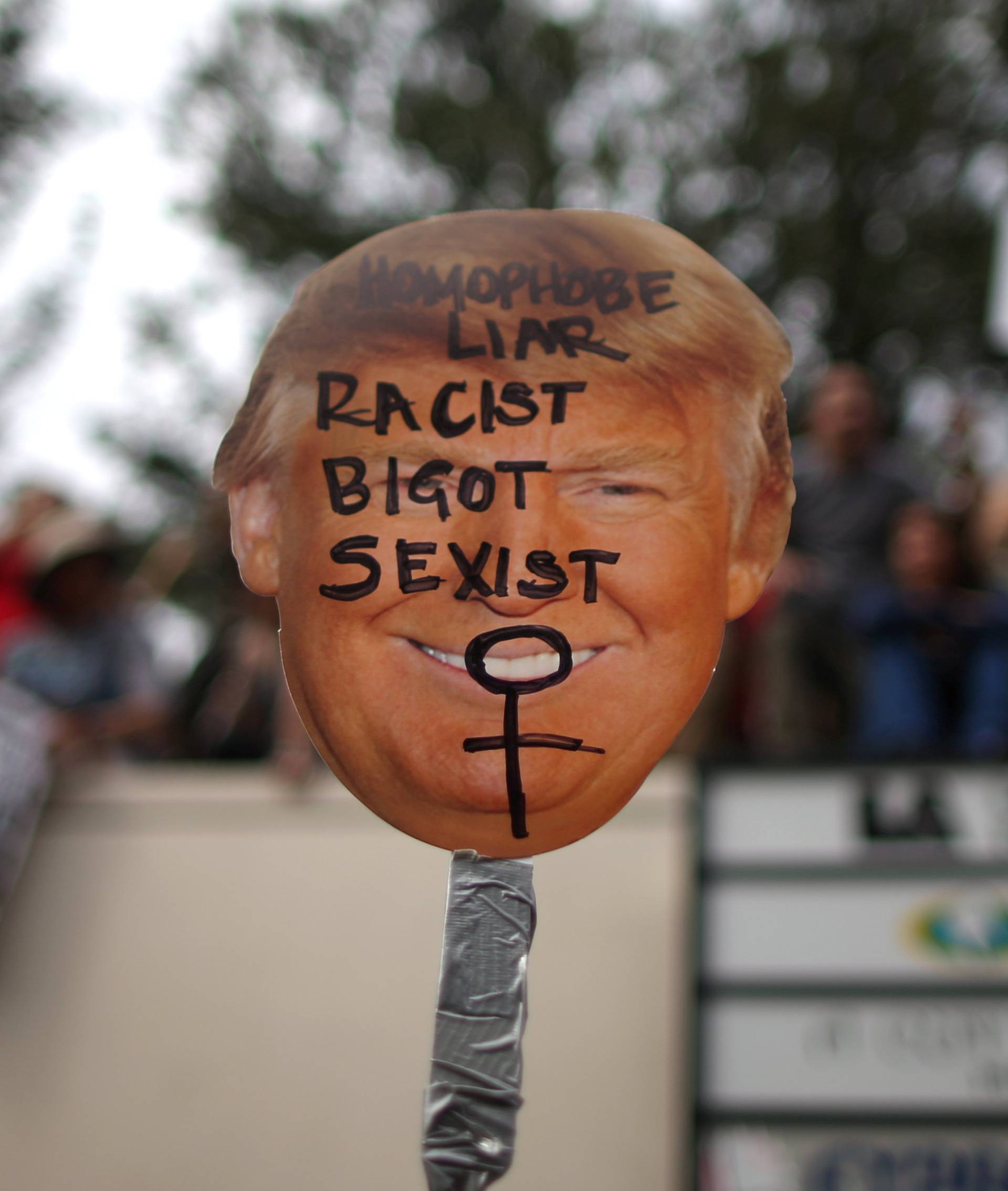 A protester holds a sign during a march and rally against the election of Republican Donald Trump as President of the United States in Los Angeles