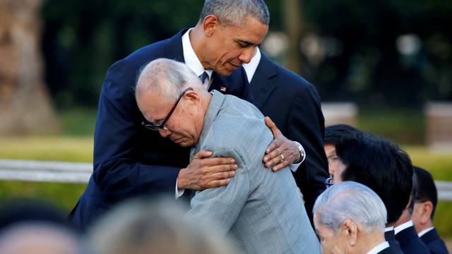 U.S. President Barack Obama hugs  atomic bomb survivor Mori as he visits Hiroshima Peace Memorial Park in Hiroshima, Japan