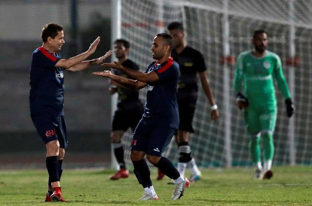 Ezzeldin Bahader, a 74-years-old Egyptian football player of 6th October Club celebrates with players after a soccer match against El Ayat Sports Club of Egypt