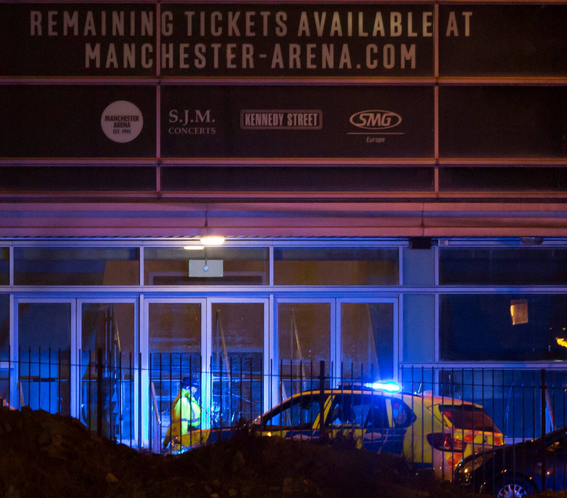Police are seen outside the Manchester Arena in northern England where U.S. singer Ariana Grande had been performing