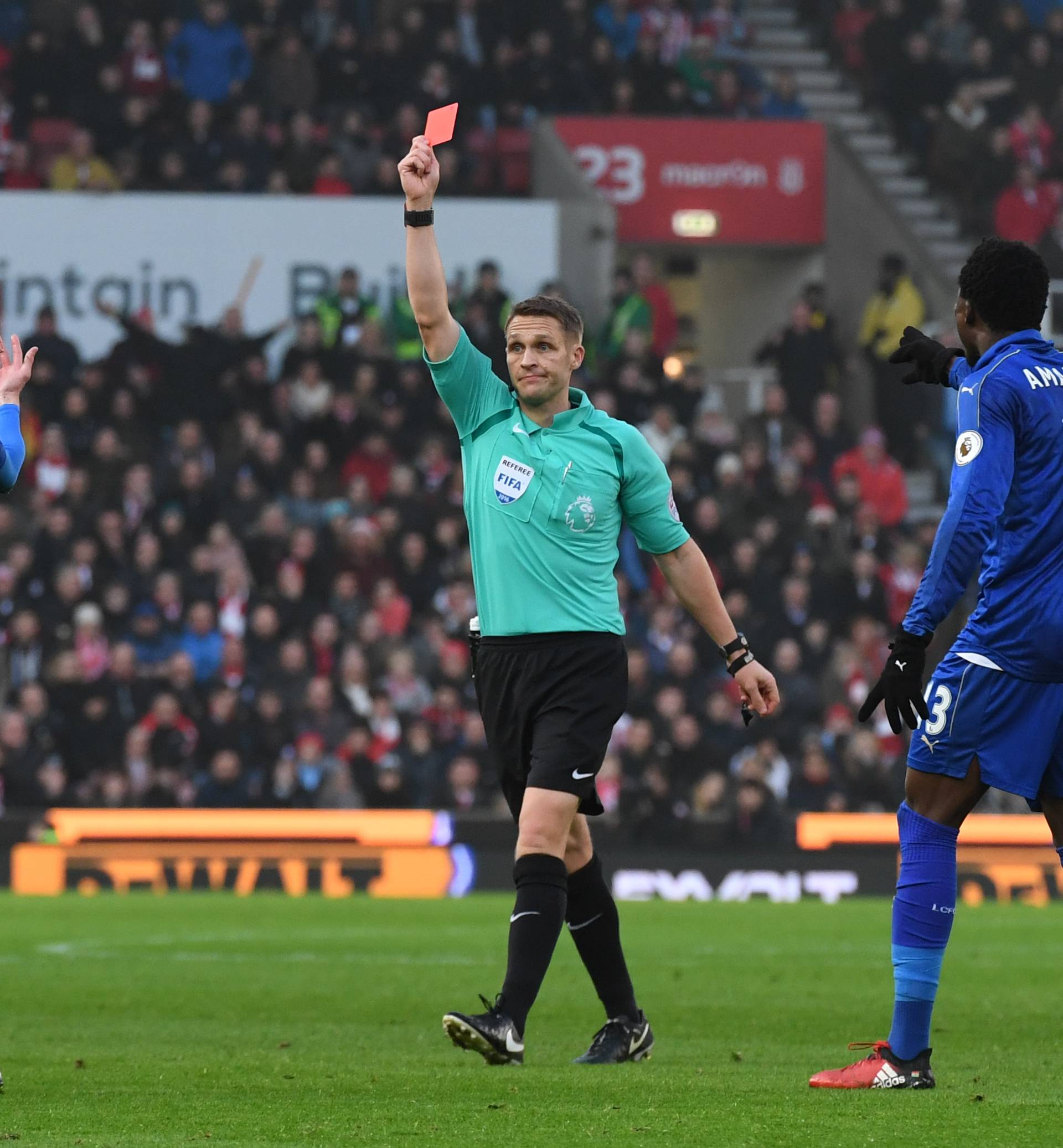Leicester City's Jamie Vardy is shown a red card by referee Craig Pawson