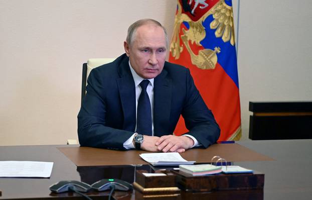 Russian President Putin chairs a meeting with members of the Security Council outside Moscow