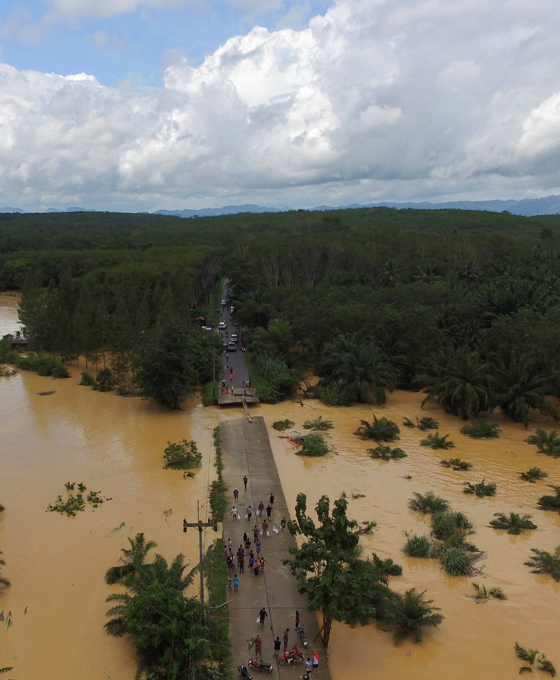 A bridge damaged by floods is pictured at Chai Buri District, Surat Thani province