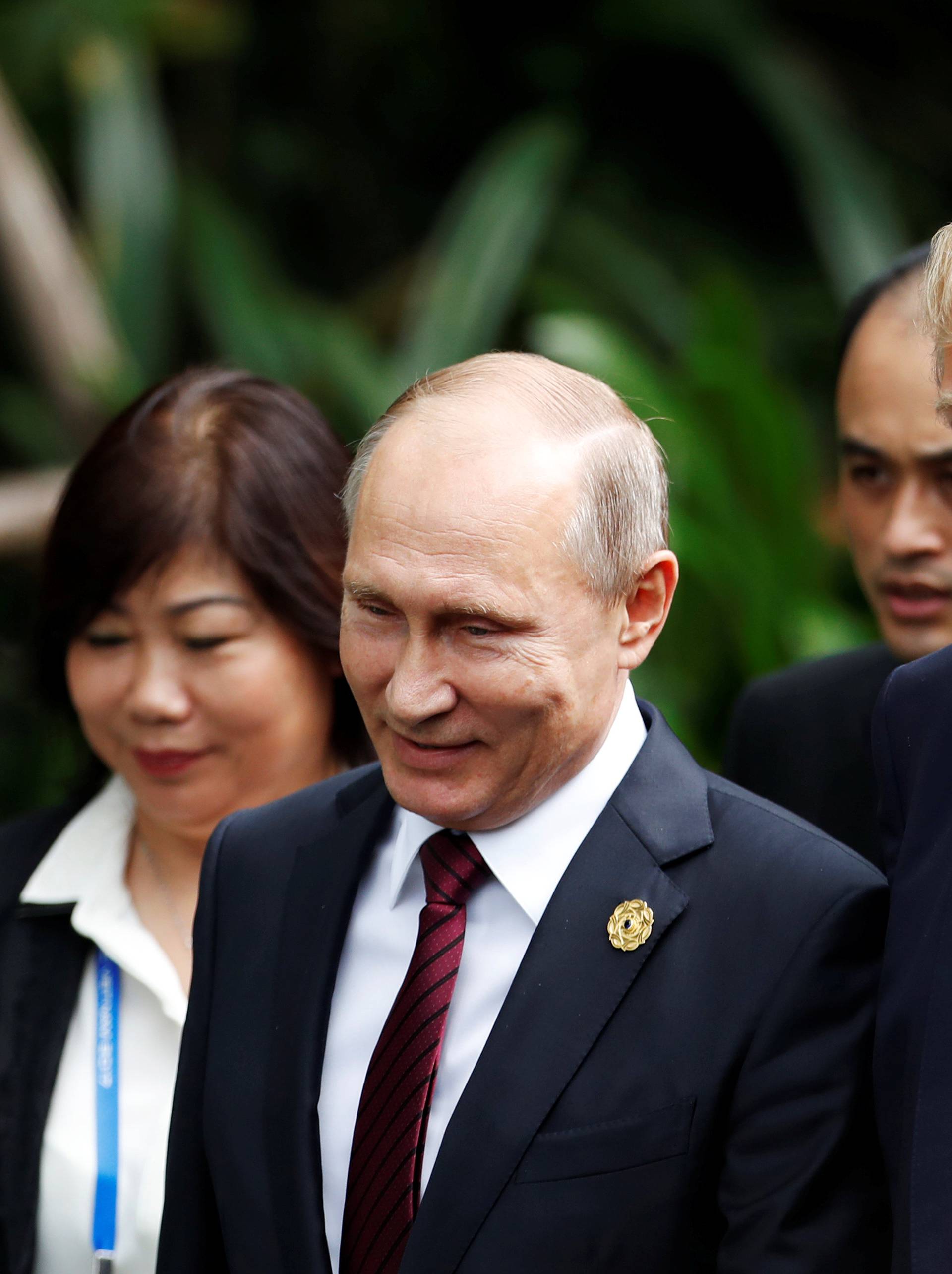 U.S. President Donald Trump and Russia's President Vladimir Putin attend the family photo session at the APEC Summit in Danang, Vietnam