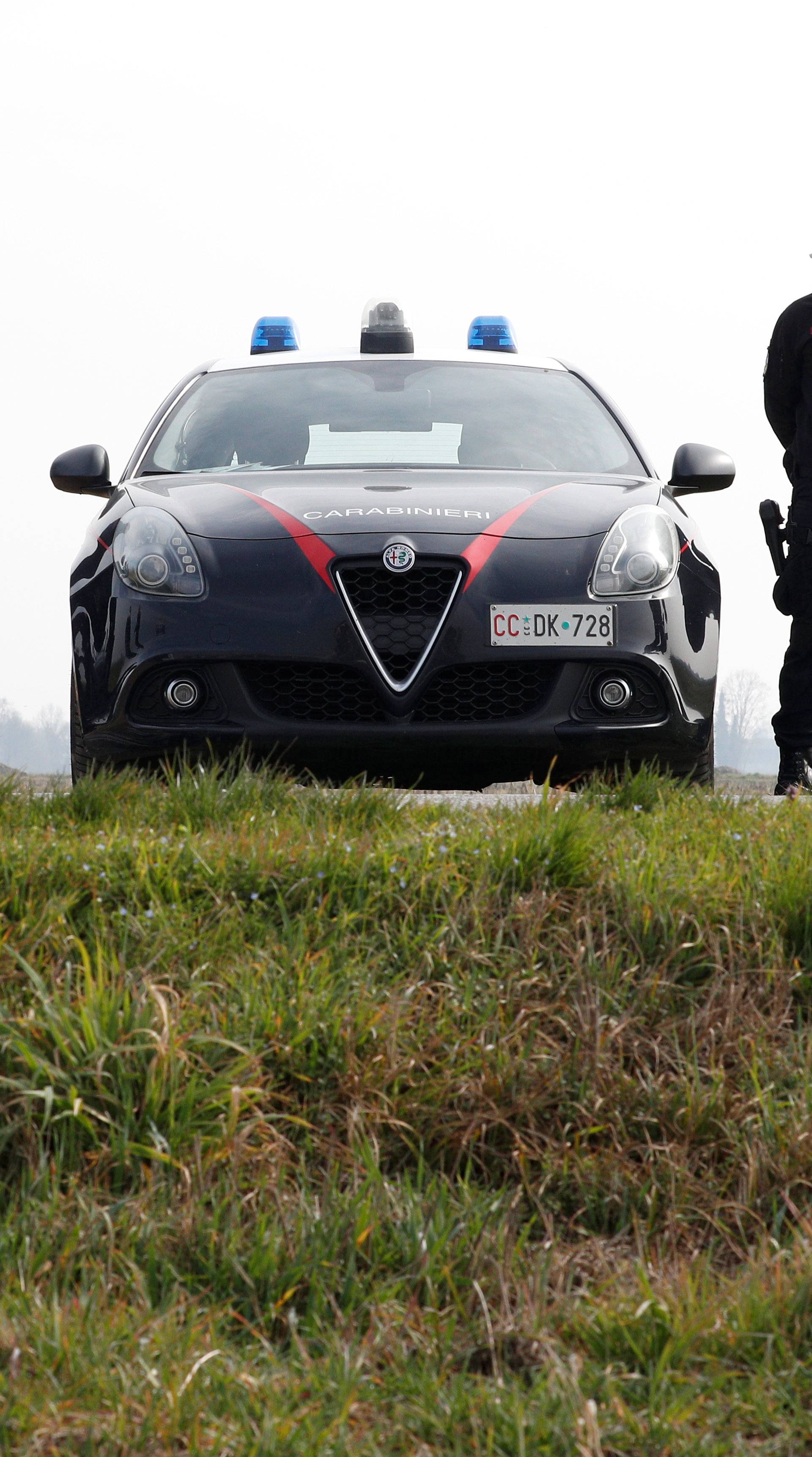Carabinieri officers patrol outside the town of Castiglione D'Adda