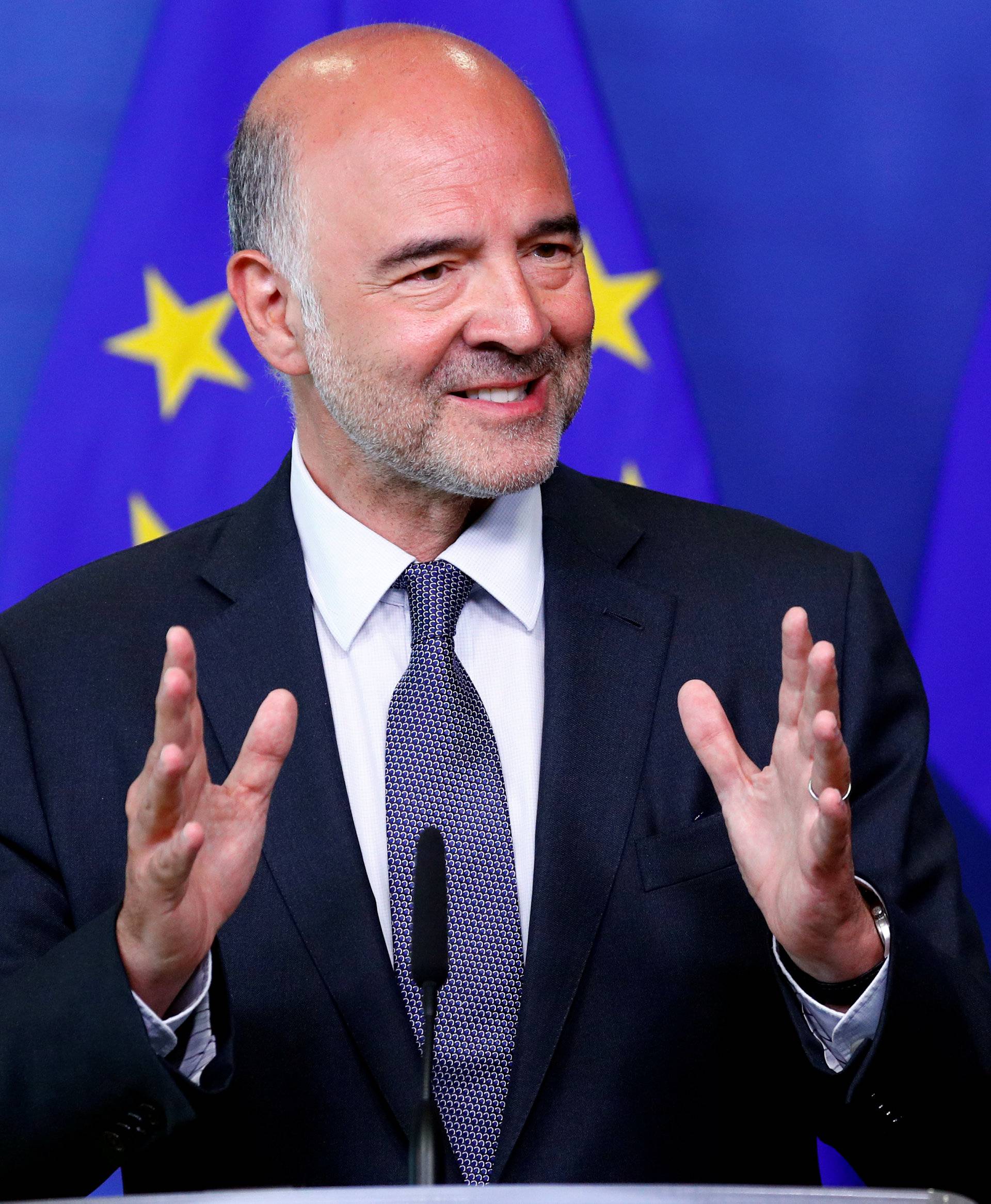 European Economic and Financial Affairs Commissioner Moscovici speaks during a news conference in Brussels