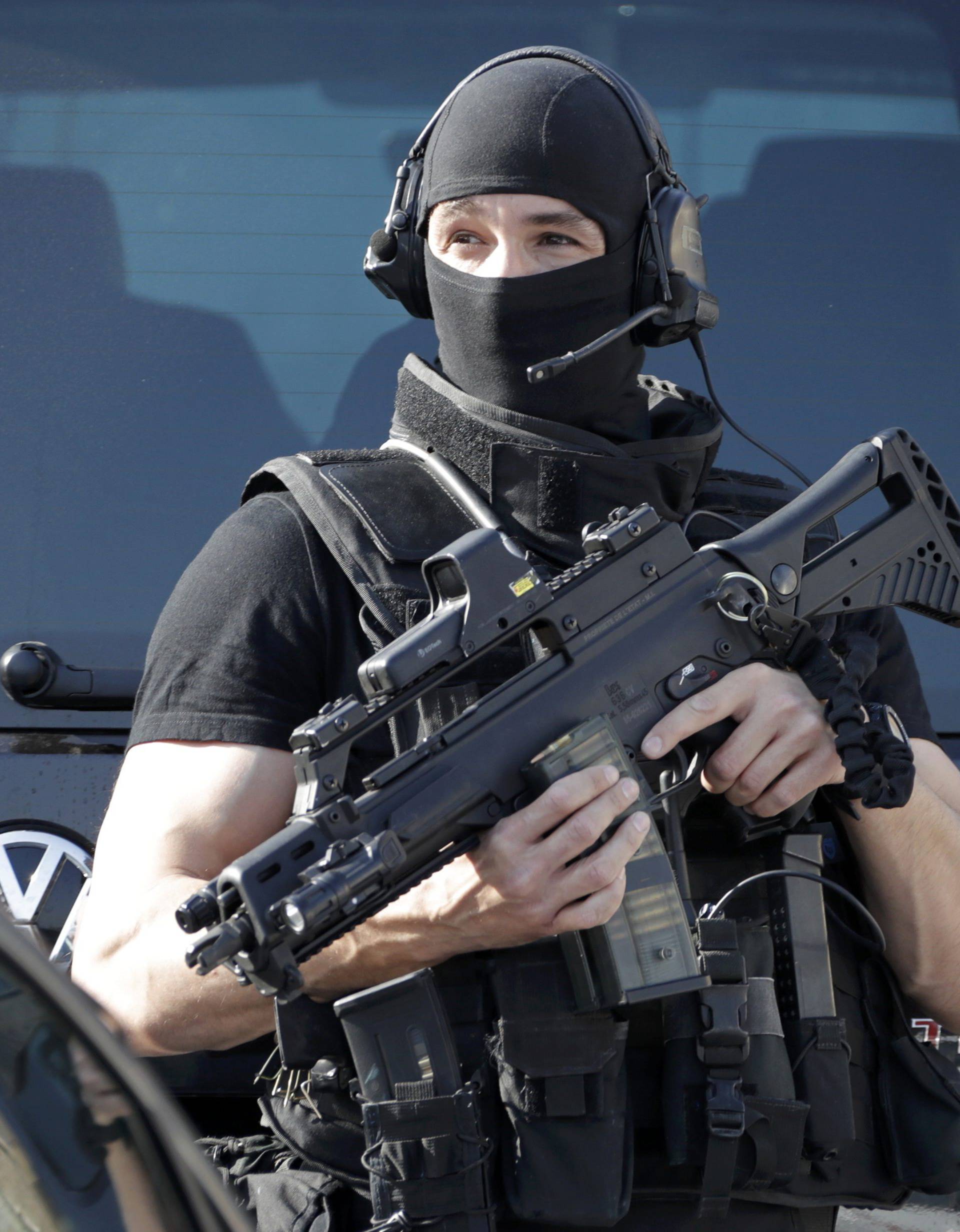 A member of special Police unit RAID outside the Tocqueville high school after a shooting incident injuring at least eight people, in Grasse