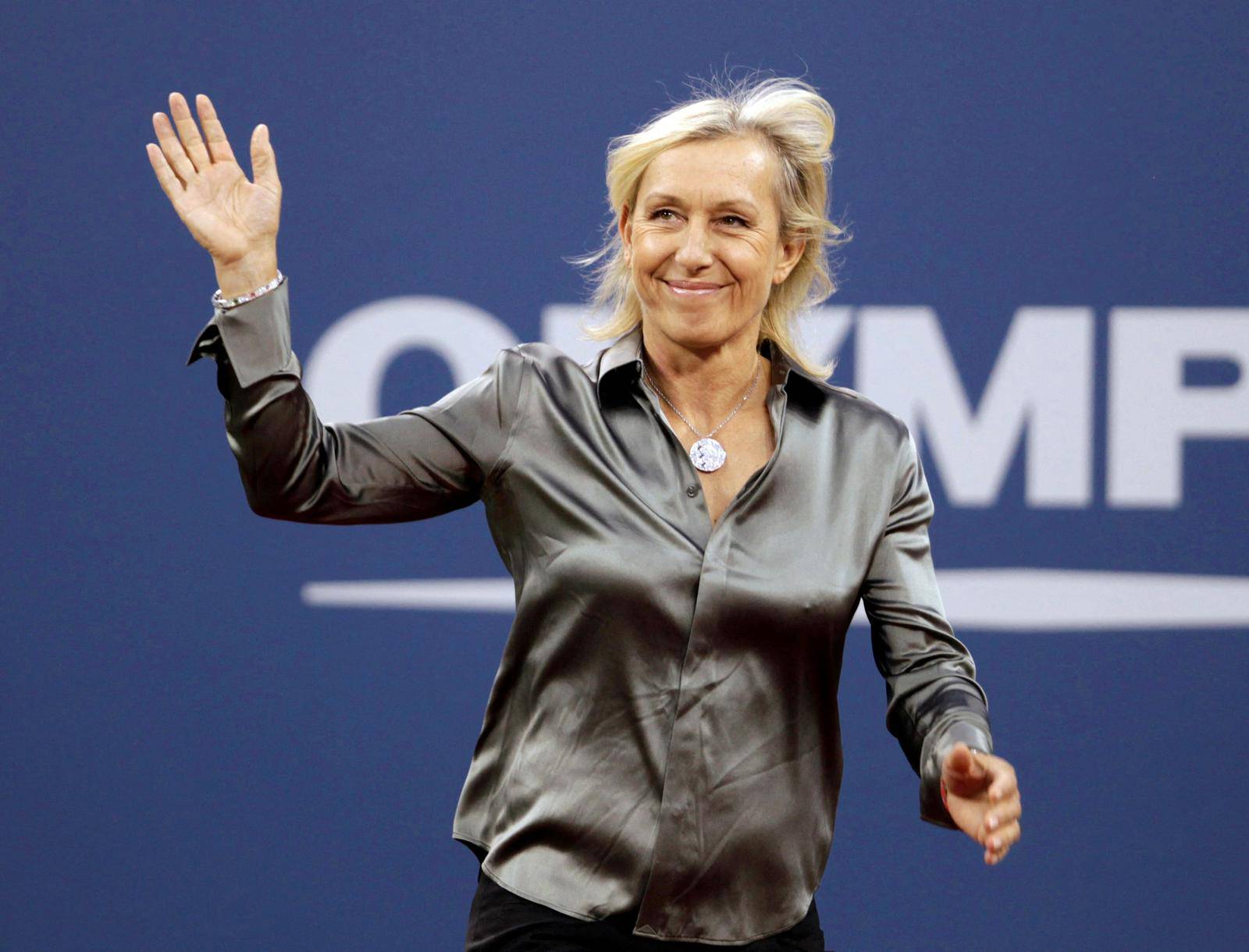 FILE PHOTO: Former tennis star Martina Navratilova waves to the crowd as she is honored during the opening ceremony of the U.S. Open tennis tournament in New York