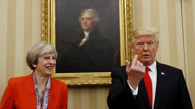 President Trump gestures as he meets British Prime Minister Theresa May at the White House in Washington
