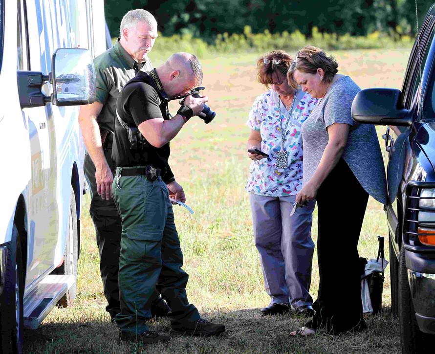 Anderson County sheriff's deputies gather evidence outside of Townville Elementary School in Townville
