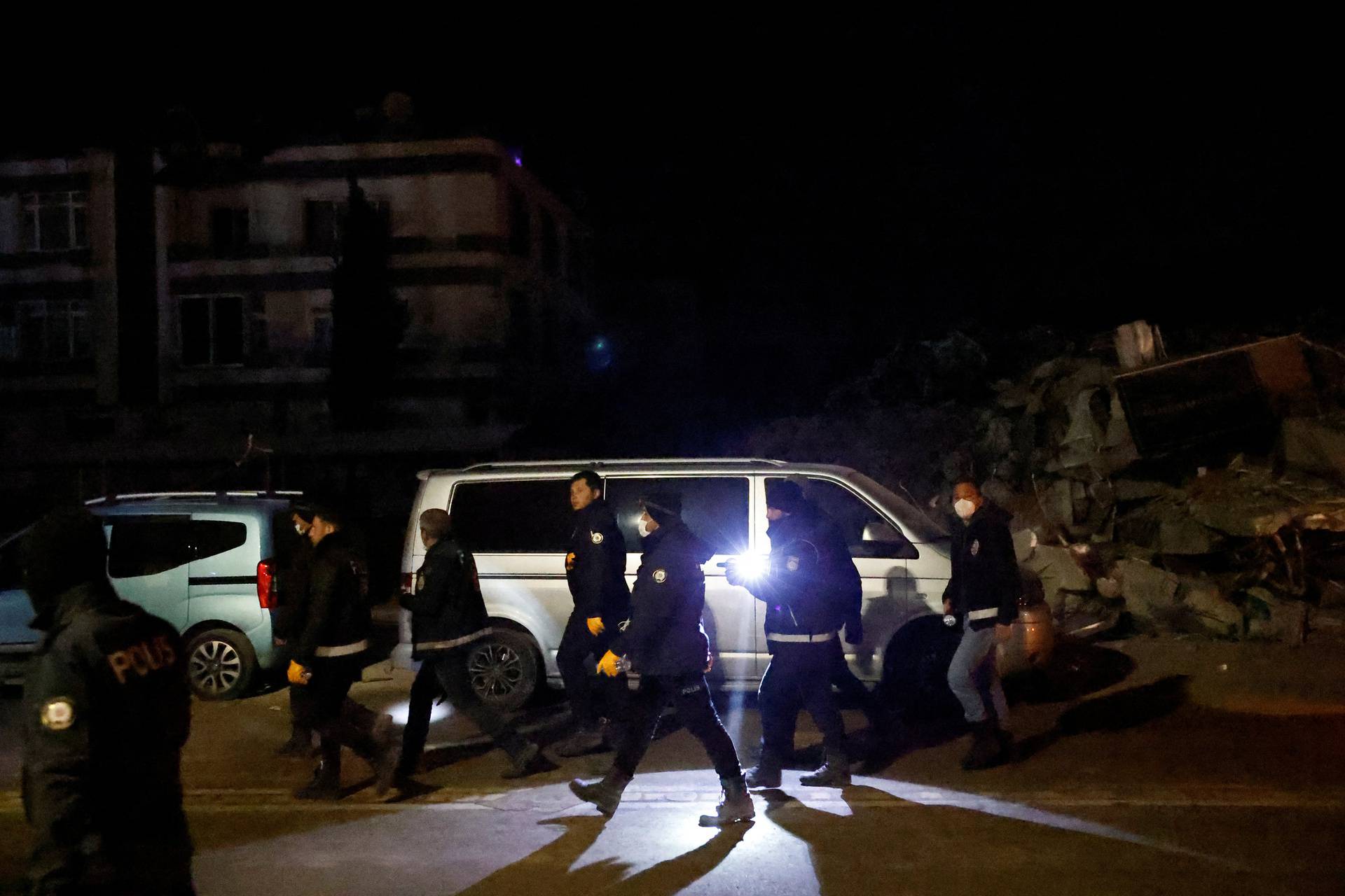 People react after a quake in Antakya in Hatay province, Turkey