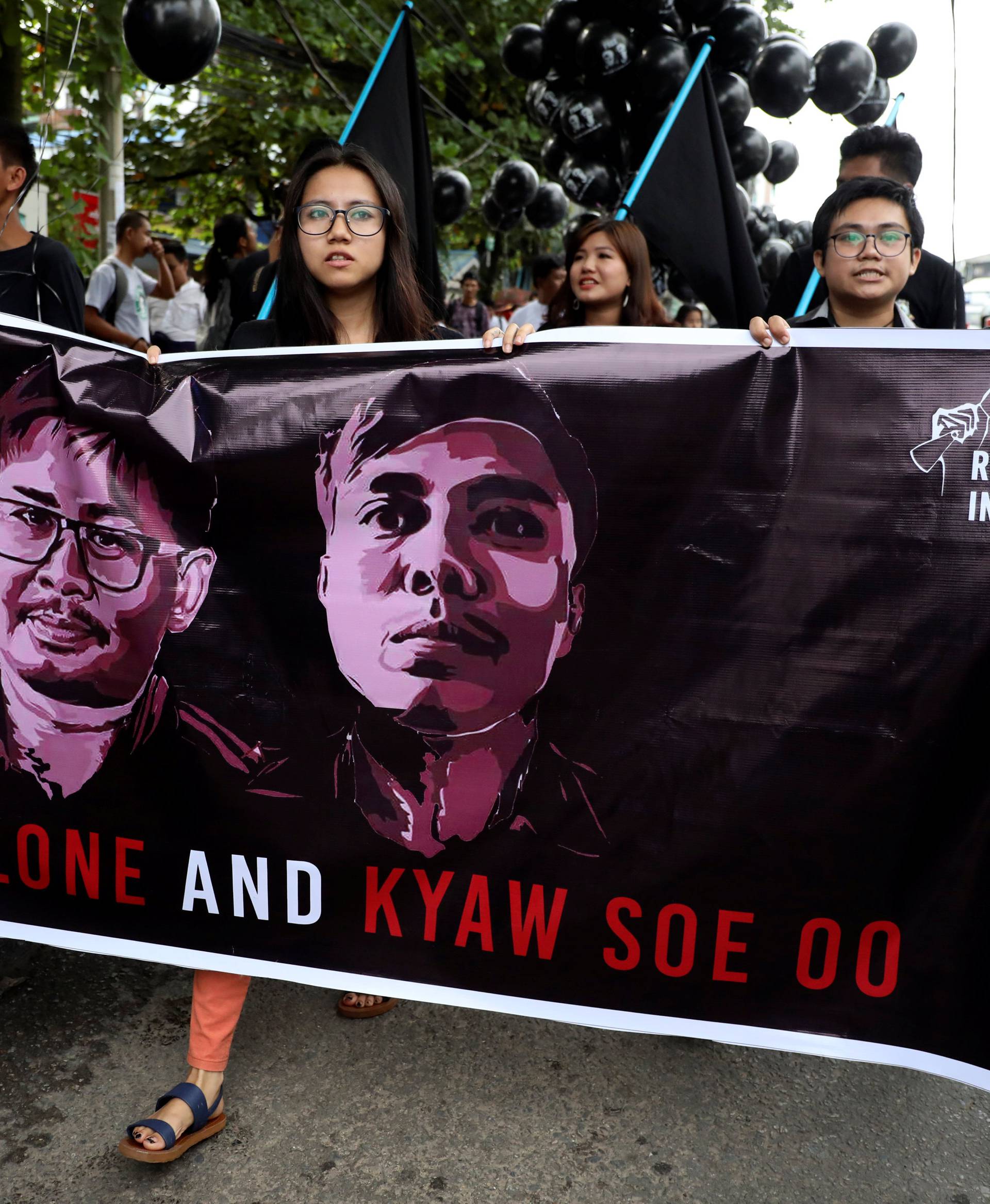 People march to show solidarity for jailed Reuters journalists Wa Lone and Kyaw Soe Oo in Yangon