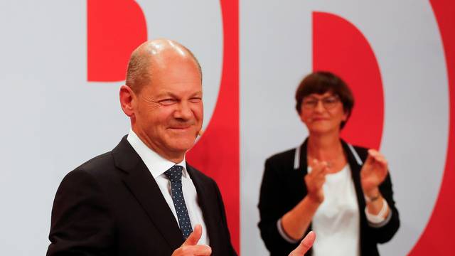 Reactions to the first exit polls from Social Democratic Party candidate Olaf Scholz and supporters at the party headquarters