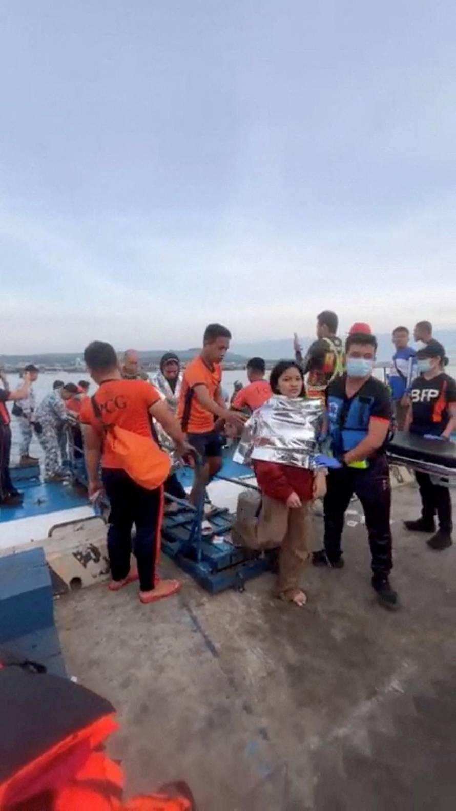 Emergency operations as victims of ferry capsize arrive in southern Philippines port