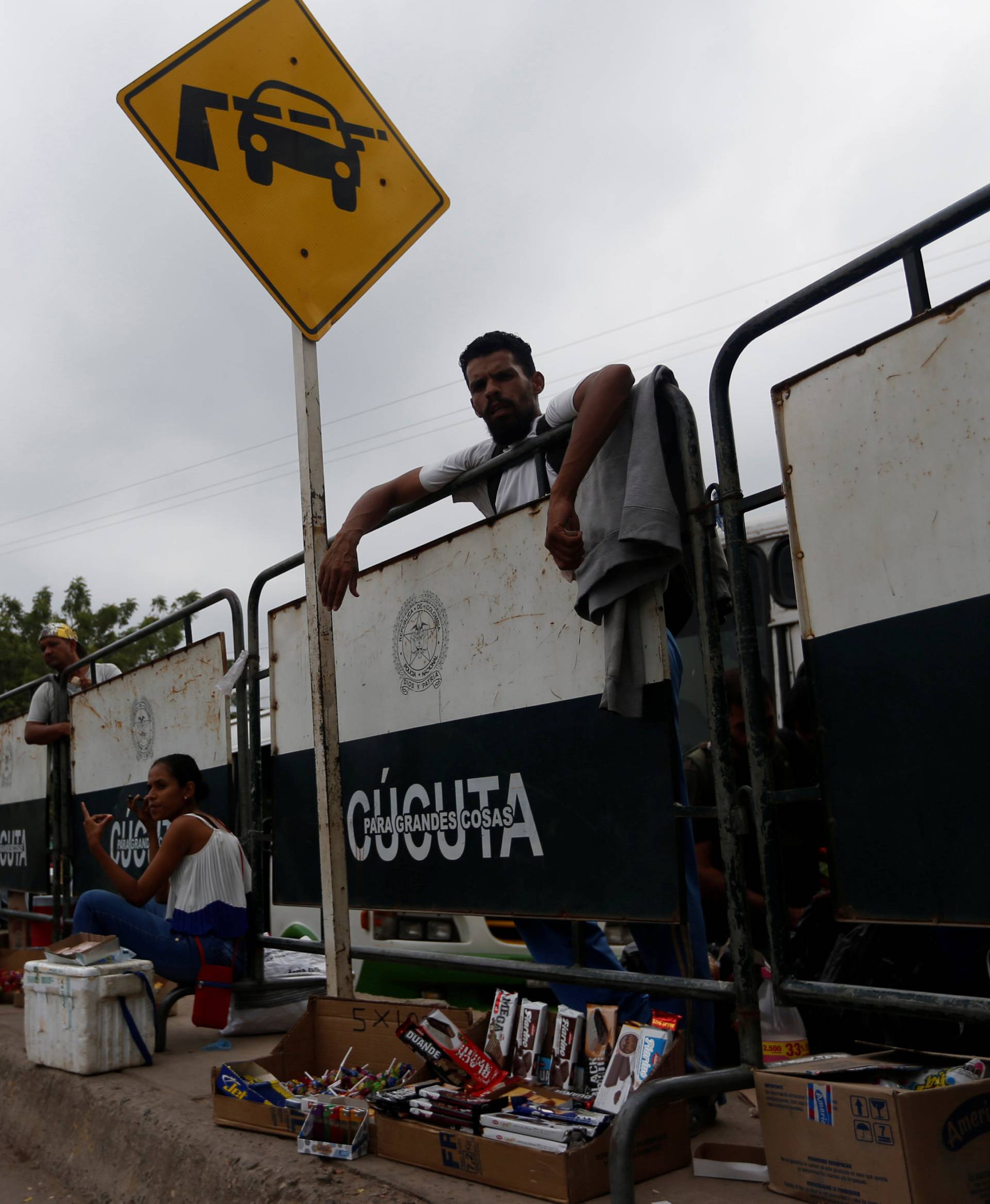 A man sells cookies and treats at the Simon Bolivar international bridge in Cucuta