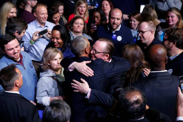Obama greets Gibbs and other people in the audience after his farewell address in Chicago