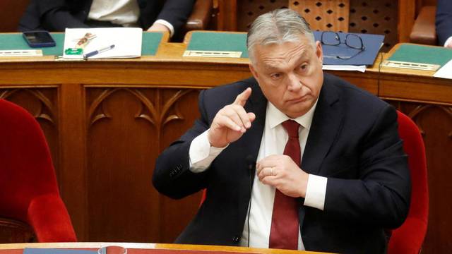 Hungarian Prime Minister Orban gestures before he addresses the Parliament in Budapest