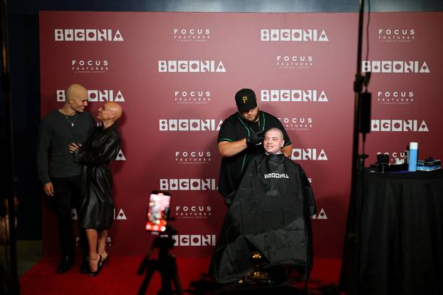 A fan gets his head shaved for a free preview of Yorgos Lanthimos’s new film 'Bugonia', in California