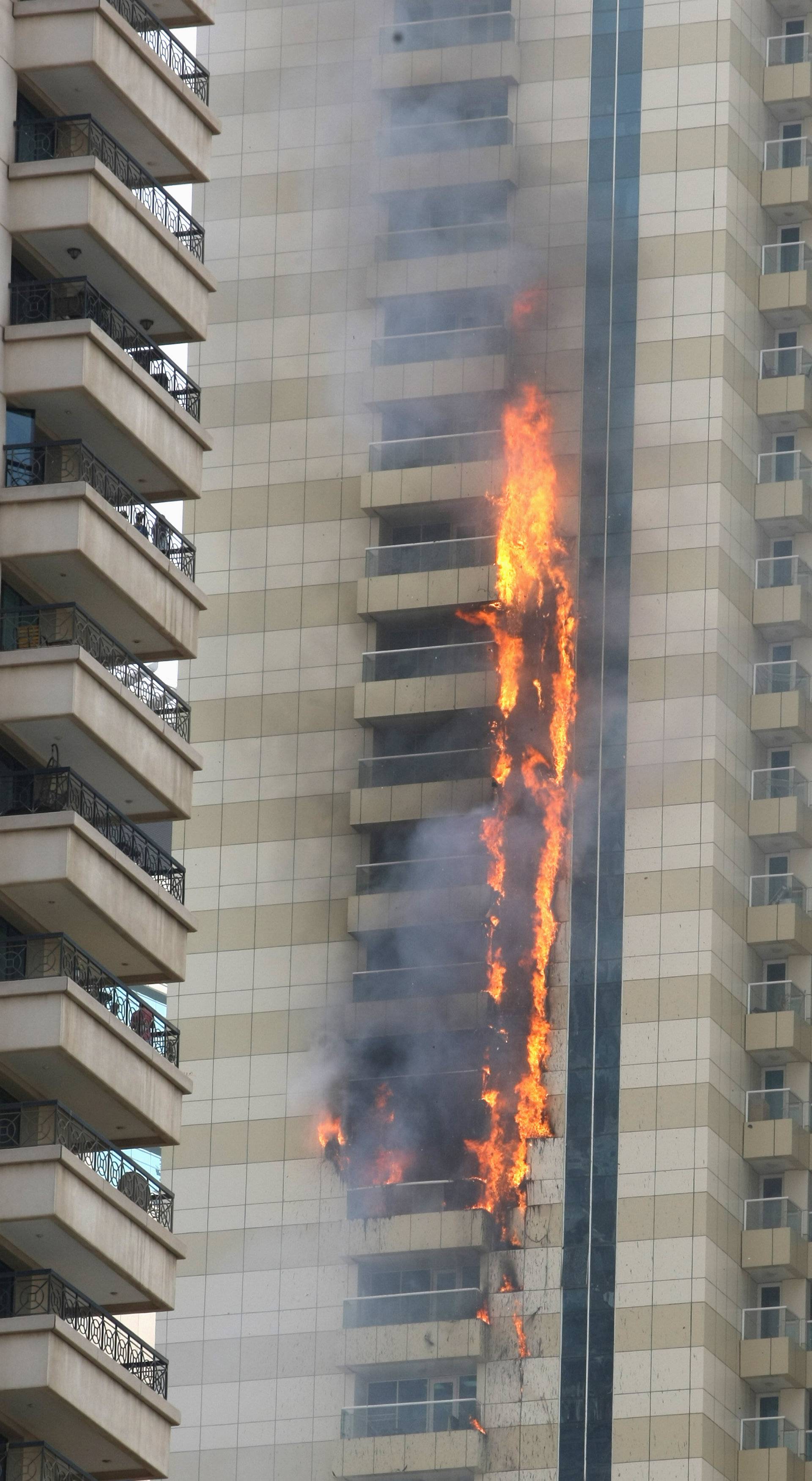 Flames are seeen after a fire broke out at residential Sulafa tower in the upscale Marina district in Dubai 