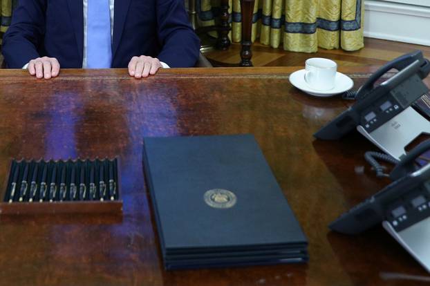 President Biden signs multiple executive orders inside the Oval Office in Washington